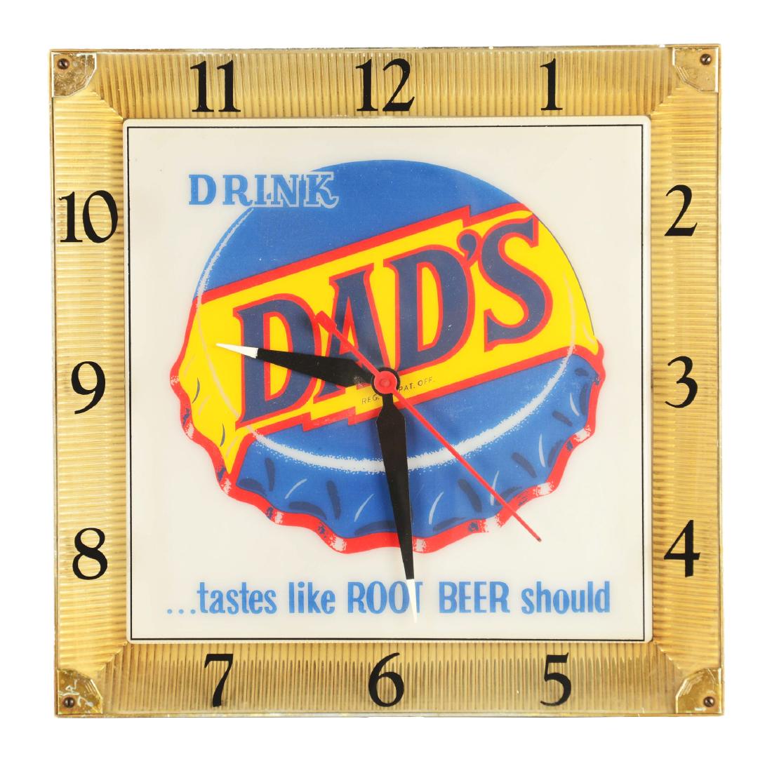 Drink Dad's Wall Clock.: This is a wall clock, reading "Drink Dad's" and "Tastes Like Root Beer Should" with a graphic of a bottle cap at the center. It is detailed in red, yellow and white with a gold finished cast aluminum