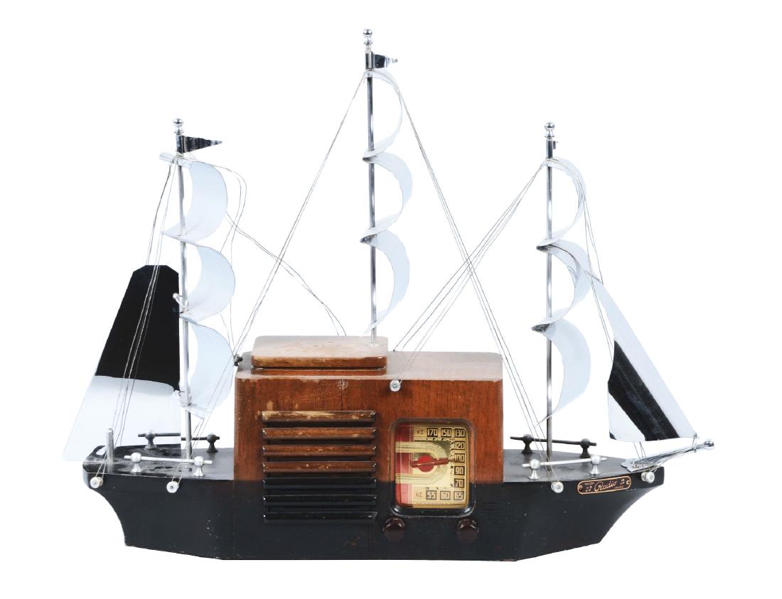 Melody Cruiser Ship Radio.: Mastercrafters Mfg. Co. of Chicago made this Model 921 radio. It has five polished metal sails hoisted with wires over the wood body. It features a 55" power cord, two dials, and a red and gold foil f