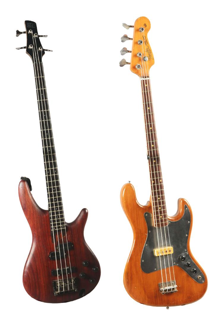Lot Of 2: Fender And Ibanez Bass Guitars.: This lot of two consists of 1 - Fender Jazz Bass with an "Offset Contour Body" as read on the headstock, but there is no serial number present. It has a natural wood finish with a metal pickguard, mat