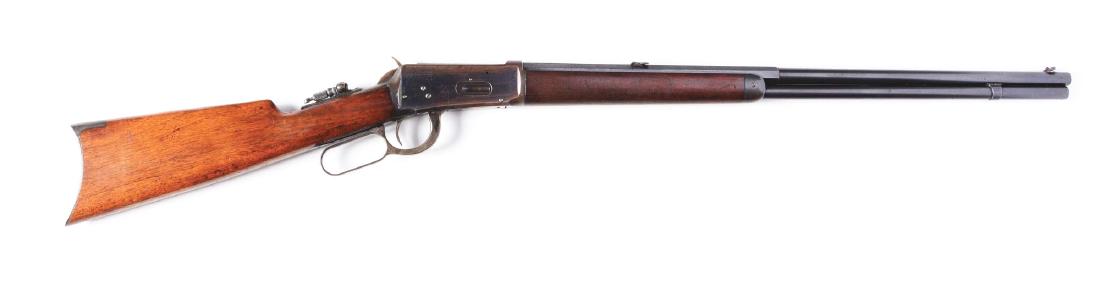 (A) Special Order Winchester Model 1894 Lever Action: This fine antique rifle features an octagon to round barrel, full magazine, sporting front sight, Lyman two leaf folding rear sight, blued finish, tang sight, walnut stocks, rifle butt and case colore