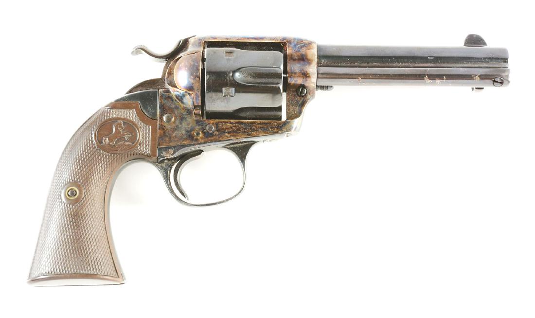 (C) Colt Bisley Model Single Action Revolver (1911).: This old Bisley was totally refinished and extremely poorly done. CONDITION: Case colors are wrong. Markings have been polished off of barrel. Pitting under bluing. Original hard rubber grips are exce