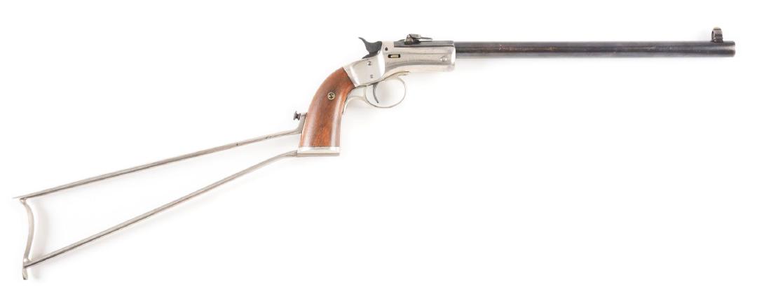 (C) J. Stevens Tip-Up Pocket Rifle.: Mathing serial numbers on nickel skeleton stock, barrel and frame. Folding long range rear sight and globe front sight. Fire blue hammer. CONDITION: Octagon to round barrel retains 75% original blue s