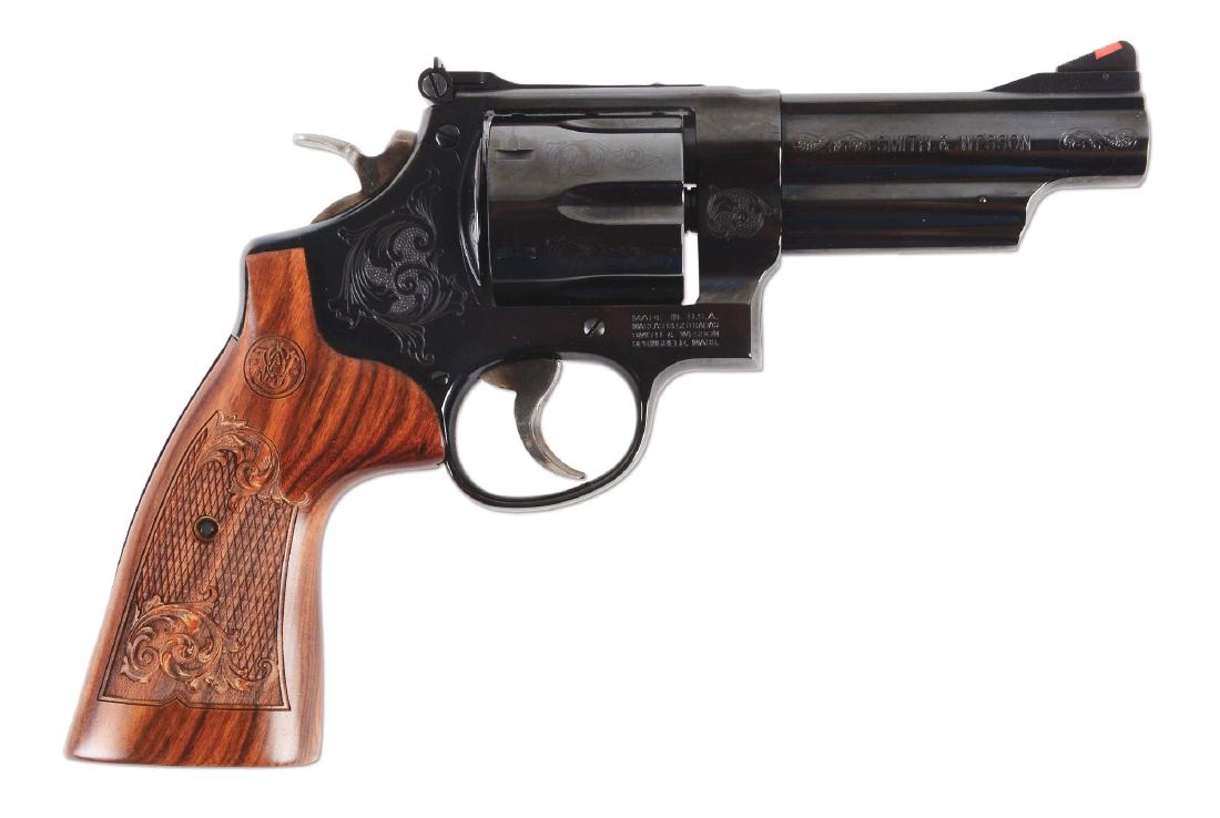 (M) Factory Machine Engraved Smith and Wesson Model 29: This Model 29 was factory engraved with gorgeous scroll work. It features the standard red ramp front sight with adjustable rear and has already been drilled and tapped for an optic. The left side of