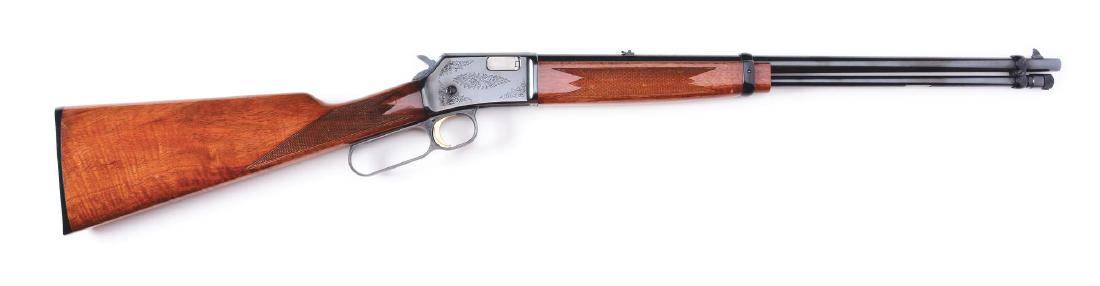 (M) Engraved Browning Lever Action Rifle.: Browning Grade 2 BL22. Made in Japan by Miroku in 1970. Walnut stock with gloss finish. Blued receiver with floral engraving pattern. Gold plated trigger and plastic Browning logo buttplate. Tube fed