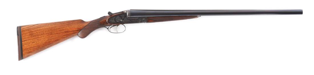 (C) Sidelock Ejector Belgian Guild Shotgun: 26" Dovetailed barrels are fitted with slightly raised matted rib. Barrel flats are stamped with 1928 Belgian nitro proofs for 2 - 1/2" chambers. Case hardened sidelock action features automatic safet