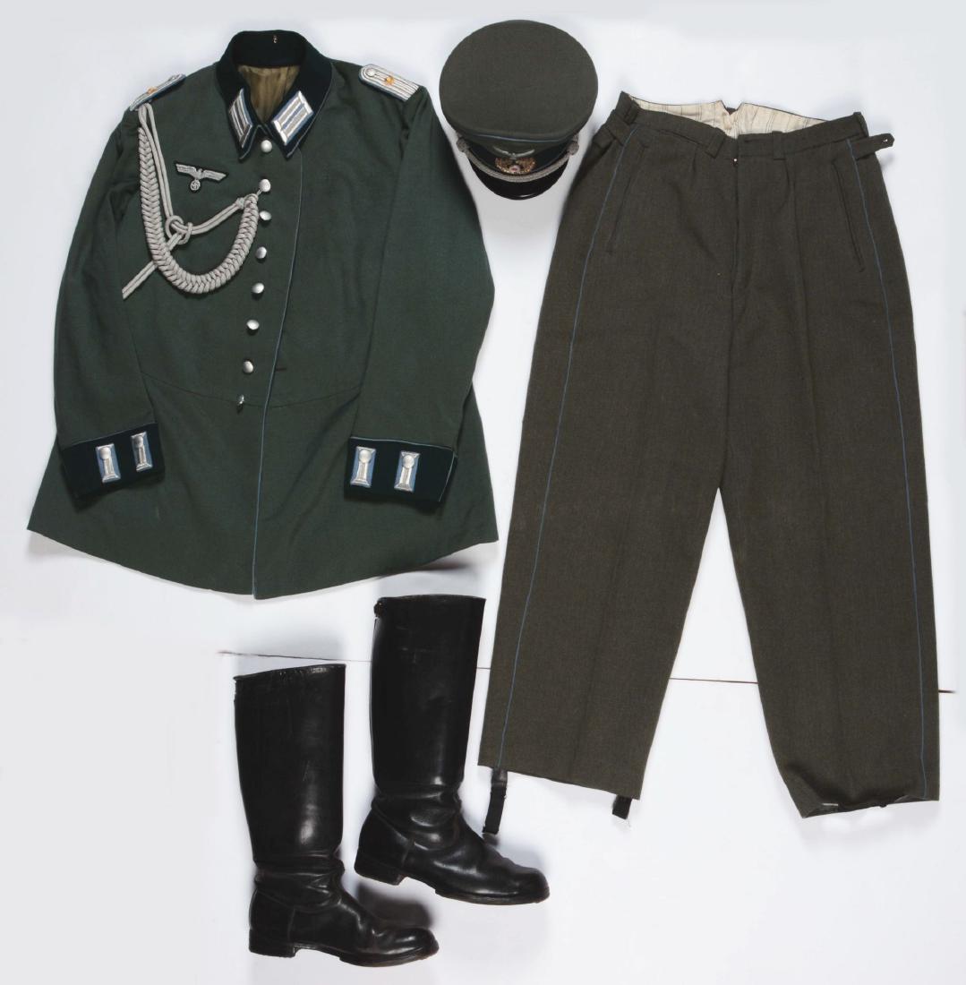 Lot of 4: German WWII Heer Officers Dress Tunic, Visor: Lot contains: (A) Heer Transportation Officer Waffenrock tunic, (B) Transportation Officer Visor cap, (C) pair of matching Transportation trousers, and (D) pair of Officer Boots. (A) Prewar Oberleutna