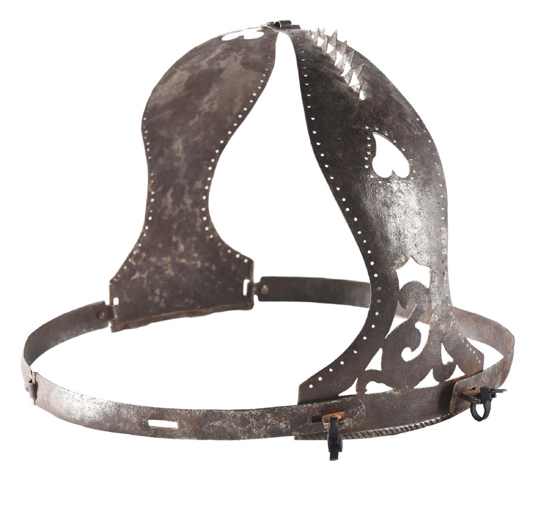Early Copy of the Classic Medieval Chastity Belt.: The chastity belt is controversial and few, if any, are believed to be from the Medieval period; however, many were made in the 19th century. This example of hand hammered steel is elaborately pierced