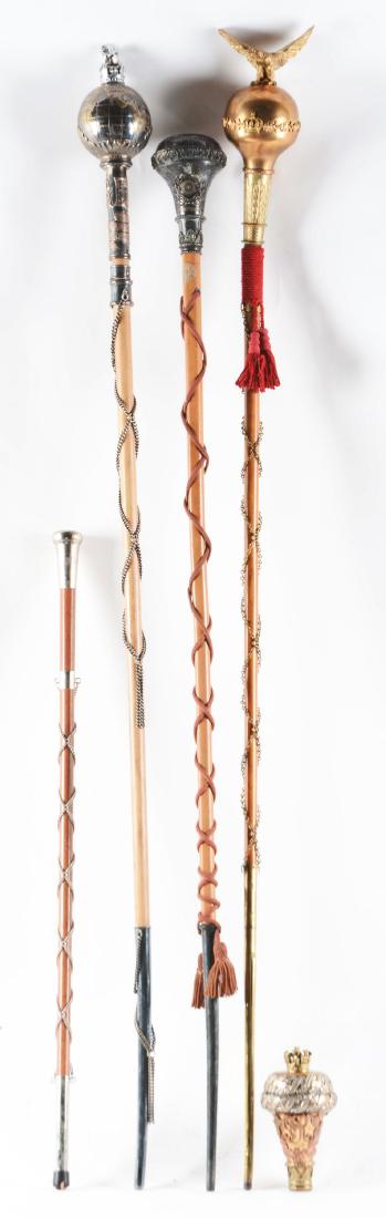 Lot Of 5: Military Drum Major Batons.: Lot contains: A) British Army baton/mace head measuring 8-1/4" high, brass with silver overlay. A ribbon on its side reads "Royal West Kent/ The Queens Own Regiment", missing the regimental crest bene