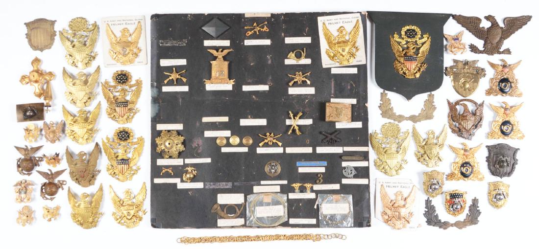 Large Lot Of American 1870-1920's Military Insignia.: Lot contains: A) 14 M1881 helmet eagle plates, a mix of regulation and non regulation examples. B) Two M1894 USMC helmet front plates which are missing reverse attachment wires. C) Three Civil War per