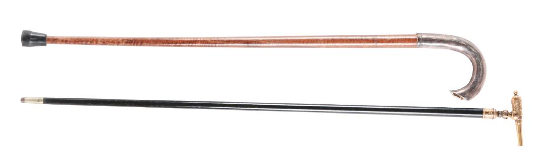 Lot Of 2: Canes Presentated To Governor General Leonard: Lot contains: A) Cane handle features a gold plated cannon sitting atop a naval capstan, finely scroll engraved and with the inscription "Hon Wm C. Wallace". Ebony shaft with nice untouched rich patin