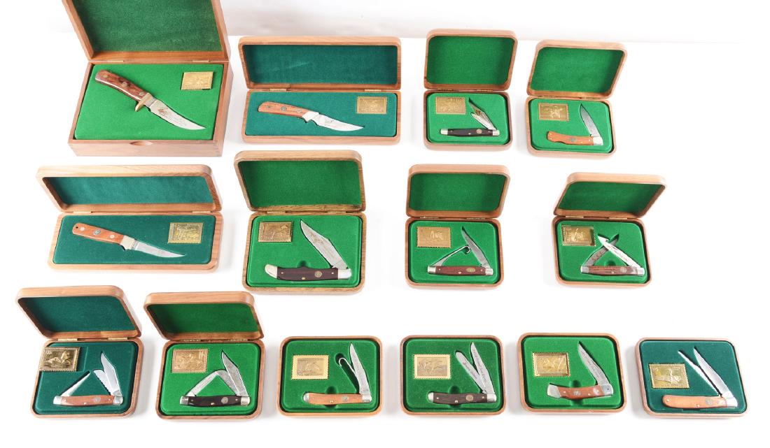 Lot of 14: Schrade Cutlery Co. Factory Hardwood Boxed: SHRADE + USA LTD. Lot contains: (A) 11 folders of one, two and three blade patterns all handled in wood. (B) Three fixed blades handled in wood. All knives include a factory hardwood box with sleeve a