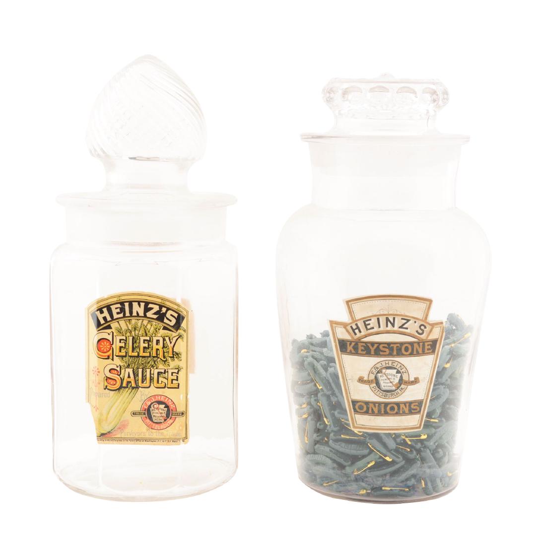 Lot Of 2: Heinz's Celery Sauce Jar and Keystone Onions: Lot consists of: a Heinz keystone onions jar with a ground neck and lid. Inside this jar are over 100 small Heinz pickle pinbacks. These pinbacks are not old. Also included in this lot is a Heinz Cele