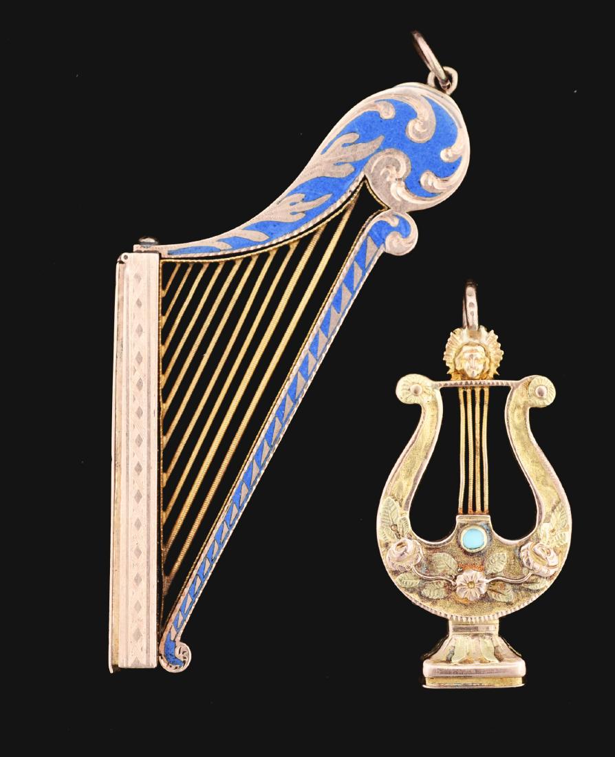 Lot Of 2: 14K Yellow Gold Vinaigrettes.: The first is lyre shaped with moonstones and turquoise with a loop to wear; the vinaigrette opens at the bottom. The second is a harp shape with enamel work where the vinaigrette opens on the side. No