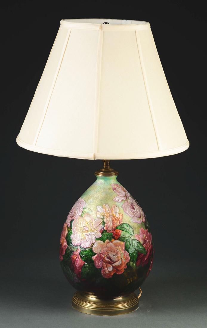 Camille Faure Table Lamp.: Faure table lamp has brightly colored, heavily enameled flowers surrounding the bulbous body of the lamp base, all against a mottled green slightly iridescent background. Base is signed near the foot