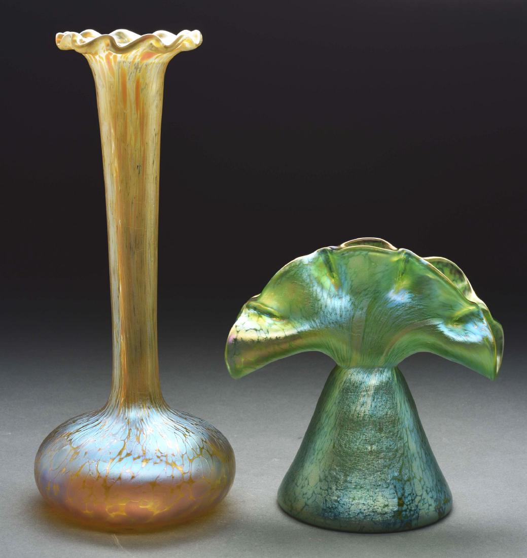Lot of Two Loetz Papillon Vases.: Lot includes: 1) Loetz vase has a fan shape with pinched lip creating five individual openings finished in platinum with platinum iridescent oil spots against a green iridescent background. 2) Loetz v
