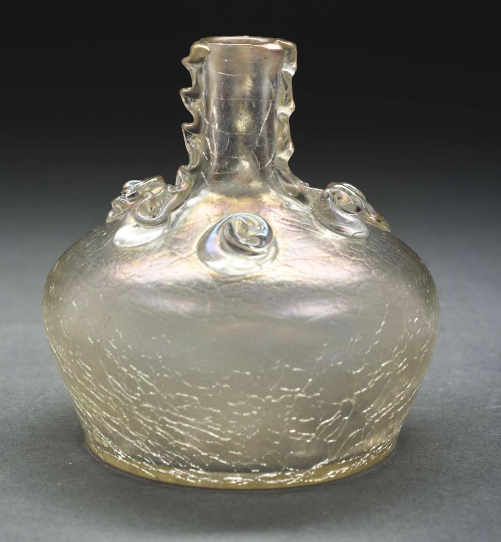 Loetz Craquele Vase.: Loetz vase in the Craquele decor has squat bulbous body and slender neck with three bands of rigaree applied vertically and three prunts decorating the top of the shoulder. The vase has a light irides