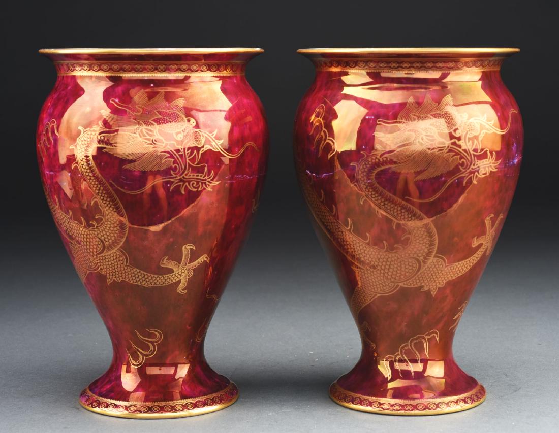 Lot of Two Wedgwood Lustre Dragon Vases.: Lot includes a matching pair of Wedgwood Lustre vases decorated with gilded dragon motif against a mottled scarlet lustre background on the exterior, and daylight lustre interiors further decorated wi