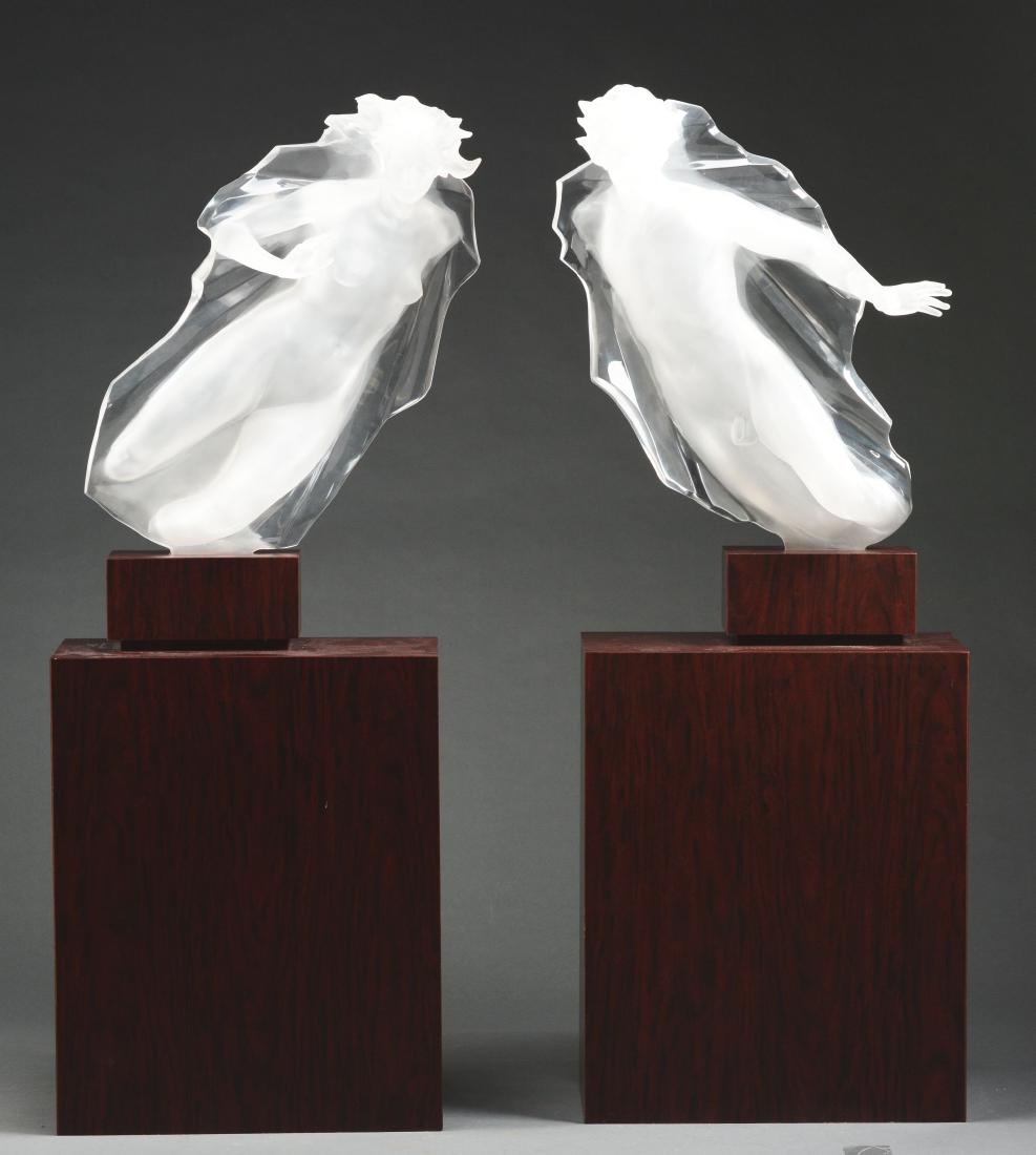 FREDERICK ELLIOTT HART (American, 1943 - 1999) "SACRED: Two clear and frosted acrylic sculptures depicting a nude male and female rising from the sea in opposite directions. Artist: FREDERICK ELLIOTT HART (American, 1943 - 1999) Condition: Very good. Creat