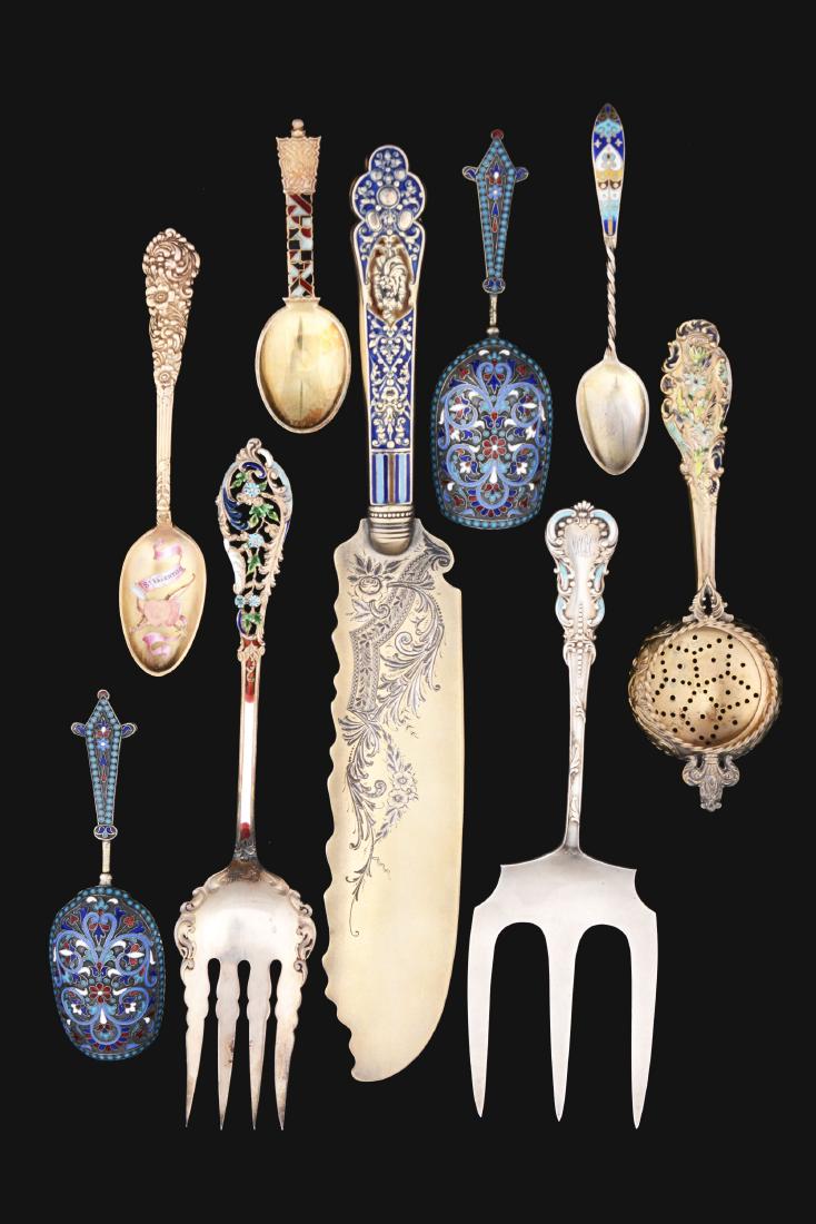 9 Gilt Sterling Serving Pieces.: All with enamel decoration, including a pair of Russian tea scoops with enamel handles and backs, dated 1893; a Gorham Old Medici pattern ice cream or cake knife, gilt; a Dominick & Haff Trianon patte