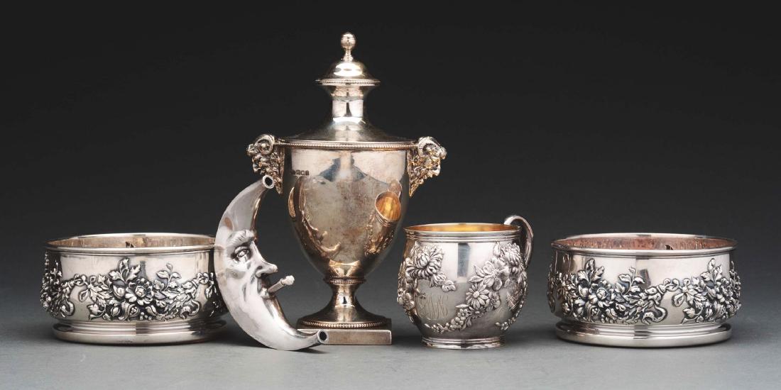 7 Sterling Silver Table Ware.: Group of sterling table wares, including a tea caddy, London 1922, Crichton, in the form of a Neoclassical vase with cast satyrs' head handles, a domed cover and socle foot, 8-1/2" high; a novelty tab