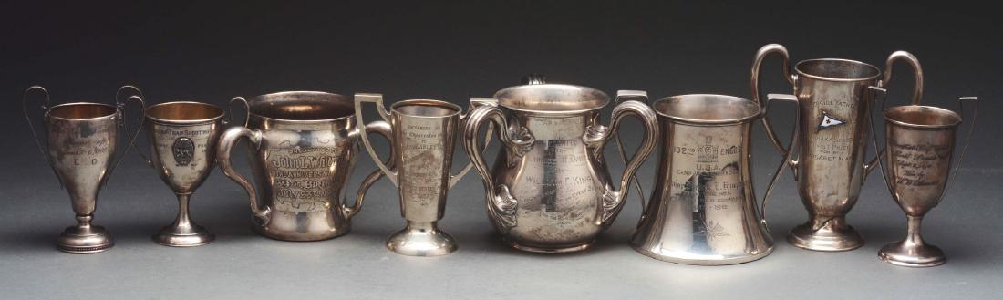 8 American Sterling Trophies.: American sterling trophies including a three handled cup, Gorham, for the championships of the Motorcycle Squad, Brooklyn and Queens boroughs of New York City; another three handled cup, also Gorham; 