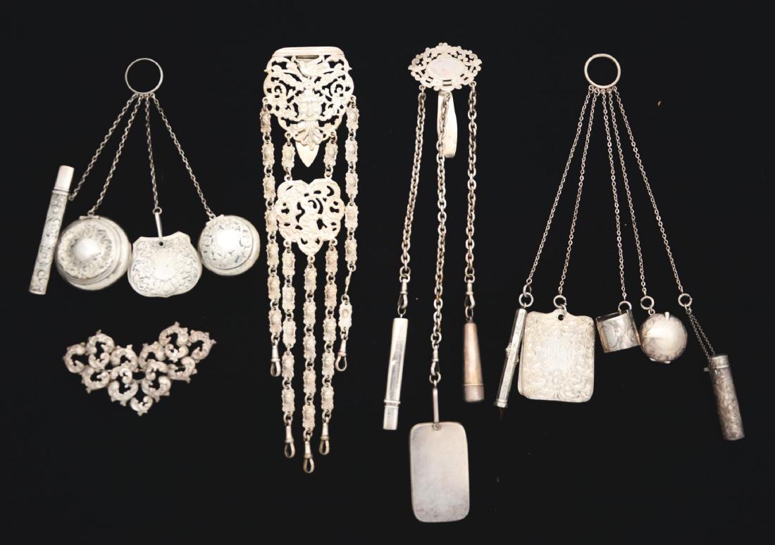 Lot of 5: Chatelaines - 3 Sterling Silver & 2 Silver: The first is sterling with a finger holder with four accessories, a note pad, compact, pencil with holder and lidded coin box. The second has a finger holder with five accessories, lipstick holder, co