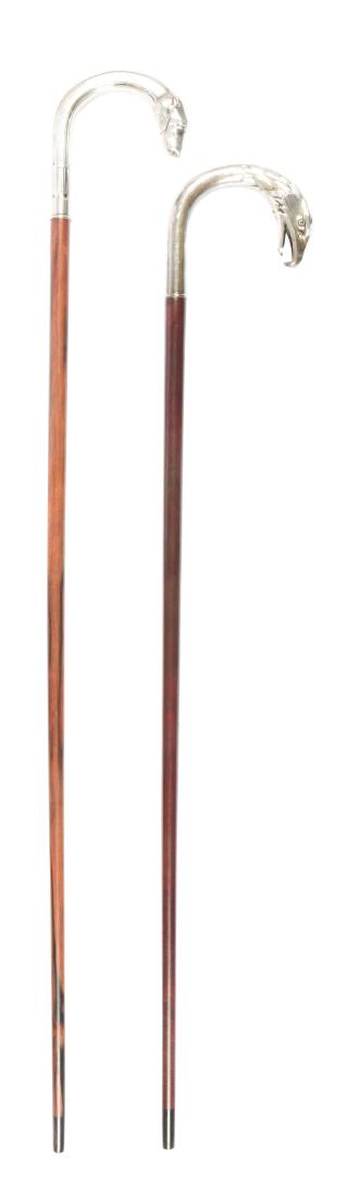 Lot Of 2: Sterling Silver Walking Stick Canes.: The first has a dog's head handle, and the second has the head of an eagle with glass eyes at the end. Condition: (Excellent). Item Dimensions: 35 - 1/4" x 5".