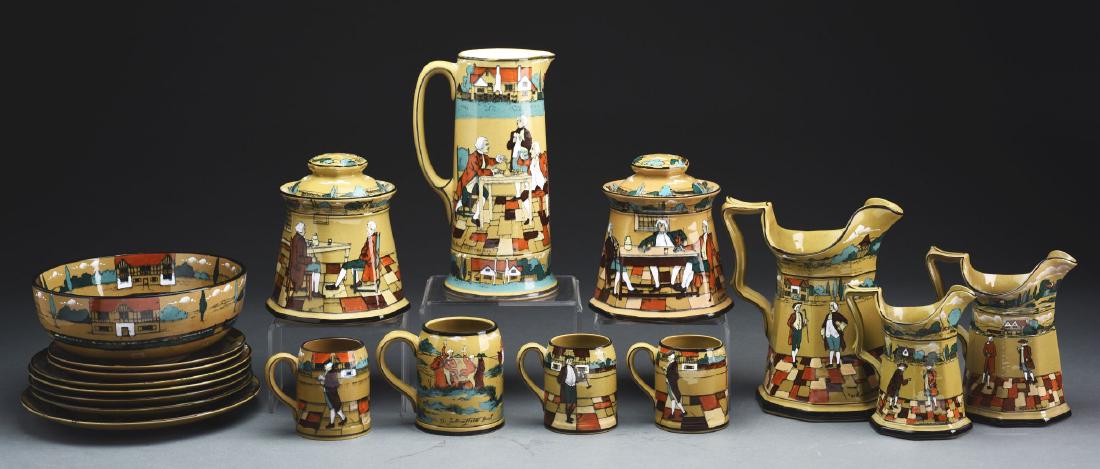Group of Buffalo Deldare Pottery "Ye Lion Inn" and: Early 20th century, Buffalo New York. Group includes: 10-1/2" tankard pitcher "The Great Controversy" 1908 backstamp, artist signed "M. Crooker", very good condition. 9-1/2" eight-panel pitcher "With 