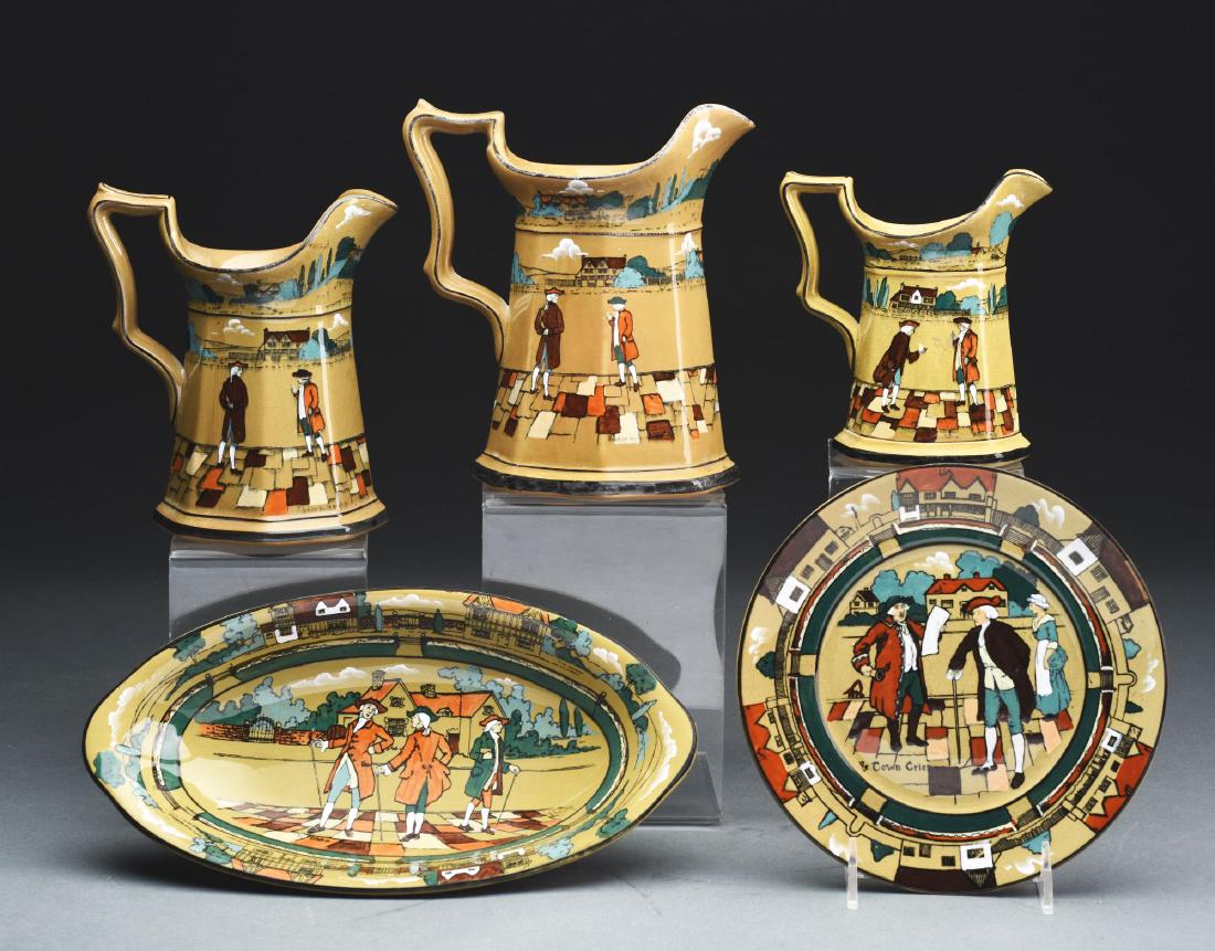 Lot of 5: Deldare Buffalo Pottery.: Group includes three graduated eight panel pitchers. The first is 6" tall with a 1908 backstamp with a shallow chip on rim. The second pitcher is 7" tall, with a 1908 backstamp and artist signed "A. W