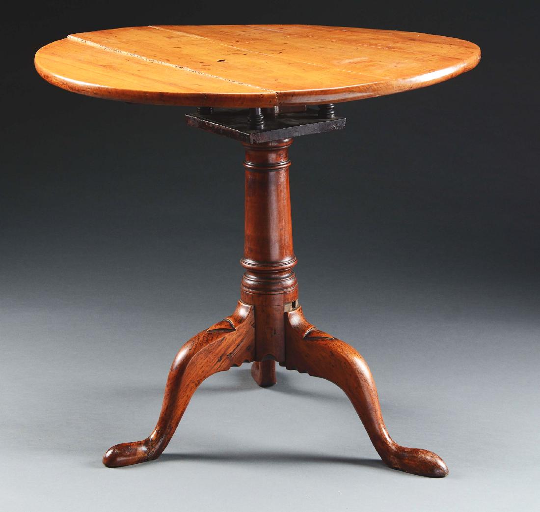 Queen Anne Cherry Birdcage Tilt Top Tea Table.: Second half 18th century, Southern New England. The circular top, hinged and swiveling on a birdcage joined to a ring-turned cylindrical standard raised on a tripod cabriole leg terminating in flatten