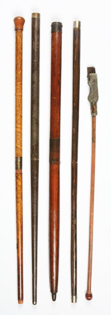 Lot Of 5: Antique Walking Stick Gadget Canes.: The first is a gadget cane with a screw handle, top section separates to form a "X" bracket. The second is a cast iron toy cap pistol gadget cane, circa 1880 by National. The third is a gadget cane th