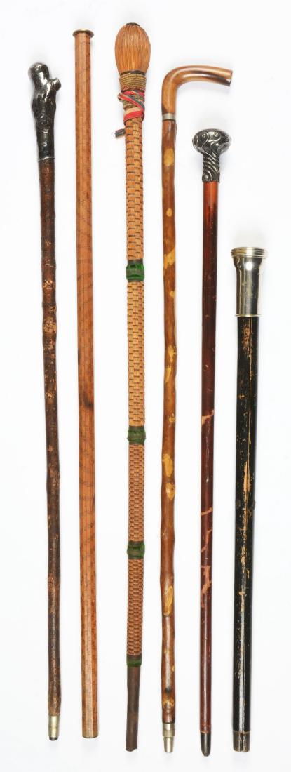 Lot Of 6: Antique Walking Stick Canes.: The first is a sterling silver handled cane of natural wood. The second is a sterling silver capped cane. The third is an unusual rope cane with a basket weave covering over wood. The fourth is a gadg