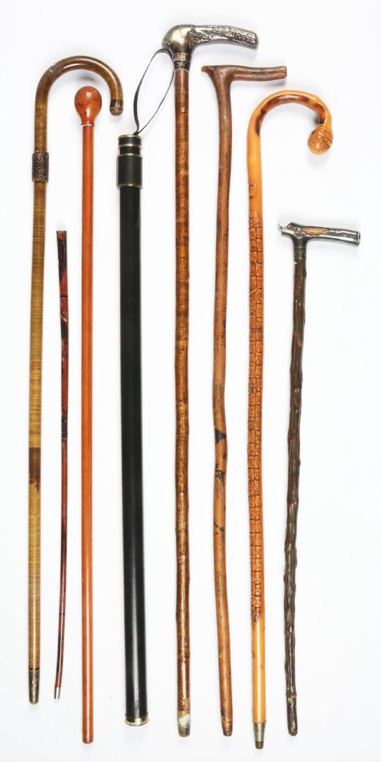 Lot Of 8: Antique Walking Stick Canes.: The first is marked "Camp Passaconaway Summer 1930" with an ink drawing of people doing activities on a natural wood stick. The second is a flute type instrument cane. The third is a plastic tube with