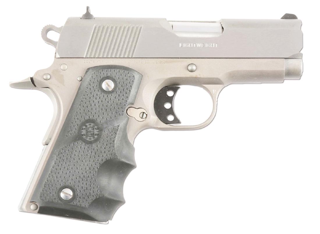 (M) Boxed Colt Defender Lightweight Semi-Automatic: Stainless steel Colt Defender Series 90, based on the old Colt Commander series. Features stainless steel, white dot sighting system, lightweight bobbed hammer, lightweight trigger, beaver tail safety