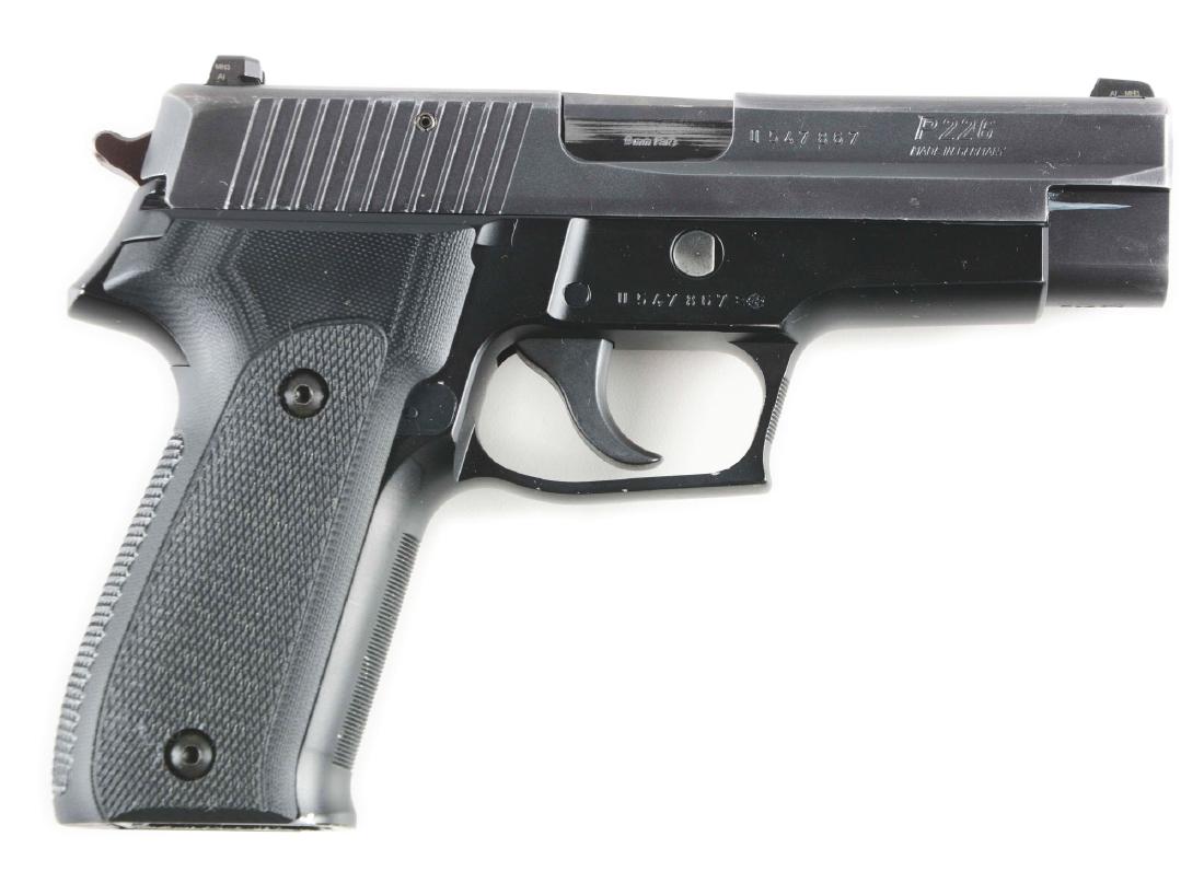 (M) Cased Sig Sauer P226 Semi-Automatic Pistol.: Features double action, white dot sights, alloy frame, black composite grips. CONDITION: Overall high edge wear evident. Some chipping of black enamel at base. No magazine. Fine bore and action. Origi