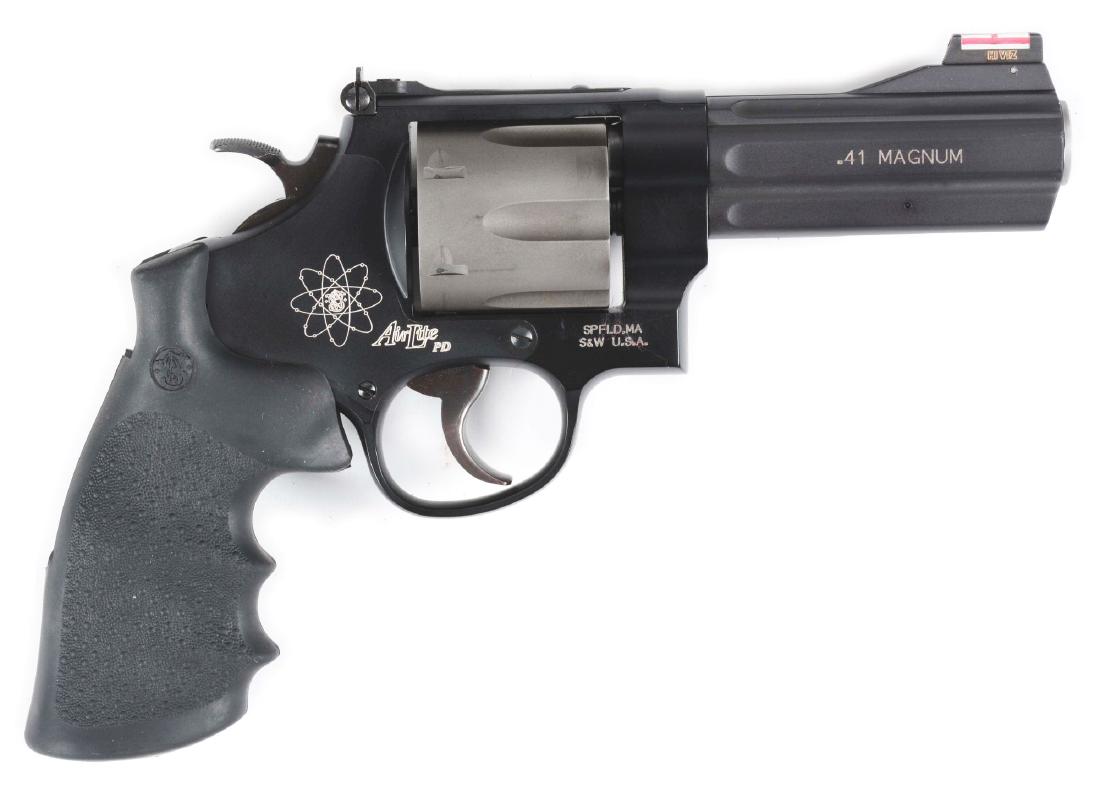 (M) Cased Smith & Wesson Airweight PD Double Action: This Airweight was built on the N frame size with the steel frame and alloy cylinder and barrel. Features luminescent front sight, adjustable target rear sight, wide target hammer and trigger, black r