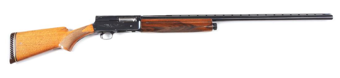 (C) Belgian Browning A-5 Magnum Semi-Automatic Shotgun.: Built in 1966, this lot exhibits a Belgian made Model A-5 3" magnum semi-automatic shotgun with fixed choke ventilated rib barrel. Blued floral engraved receiver and trigger guard. Walnut checkered pi