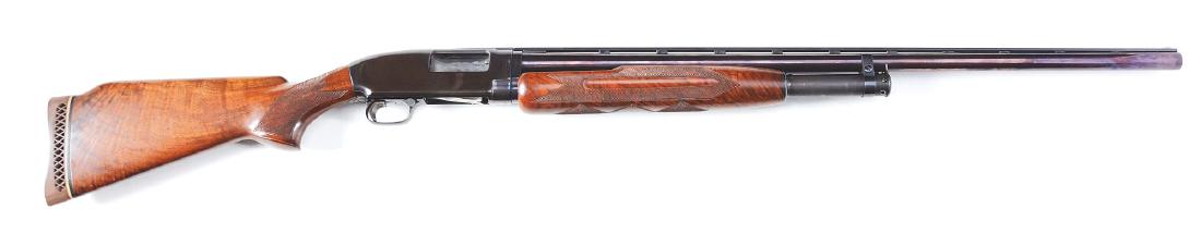 (C) Custom Winchester Model 12 Slide Action Shotgun: Venerable old faithful Model 12 pump action takedown 12 gauge shotgun. Brought into the modern era with addition of a Simmons rib, a red fiber optic front sight, custom highly grained finely checkered