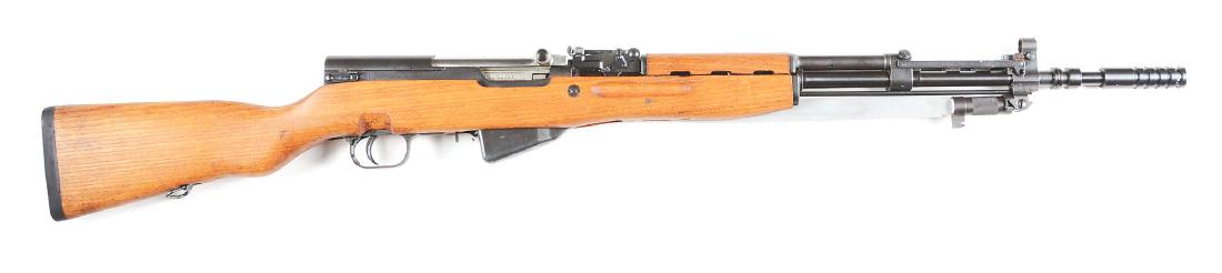 (C) SKS Semi-Automatic Rifle with Grenade Launcher: This rifle was introduced in 1946. Matching numbers on frame, bolt, trigger guard, magazine and stock. Rear sight is graduated to 1,000 meters. Standard features include folding bayonet, hardwood stoc