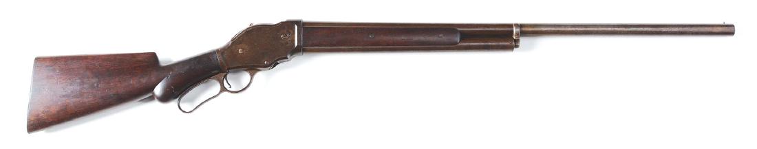 (A) Winchester Model 1887 Lever Action 12 Gauge Shotgun: Standard features include a round fluid steel barrel, half magazine, walnut stock with two piece forend, round knob pistol grip, checkered steel shotgun buttplate. CONDITION: All metal has basically t