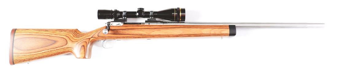 (M) Savage Arms Model 12 Bolt Action Rifle with Mounted: This beautiful high quality, heavy barrel, varmint rifle features stainless steel construction, fluted barrel, pistol grip laminated stock, straight comb, solid red rubber pad, stainless steel sling e
