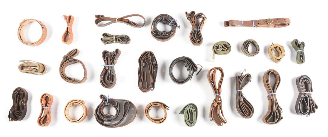 Lot of 27: Large Lot of Slings and Prop Guns.: Lot consists of: 1903 slings, various military slings, and three mock firearms. There are numerous slings including three Springfield single brass frog sling for a trapdoor or Krag, four slings with s