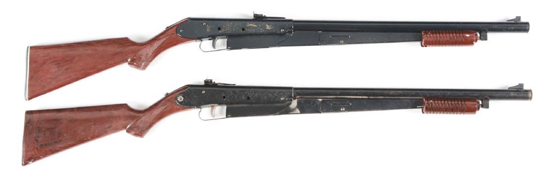 Lot of 2: Daisy Model 25 Air Rifles.: Lot consists of: Gun (A) Daisy Model 25 pump action air rifle with blade front sight and elevated rear sight. Plastic stock and forearm. Duck and floral design embellishment on action. CONDITION: Over