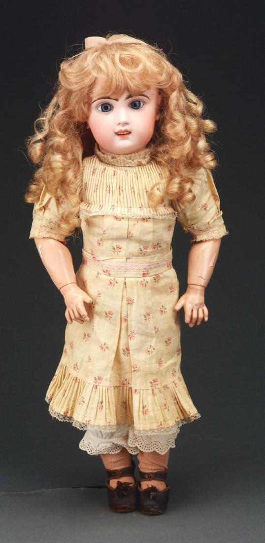 Tete Jumeau #8 Bebe.: 20", #8, bisque socket head on jointed composition body, set blue glass eyes, open mouth with teeth, pierced ears with earrings, original Jumeau dress, shoes and stockings, replaced wig. Marked on hea