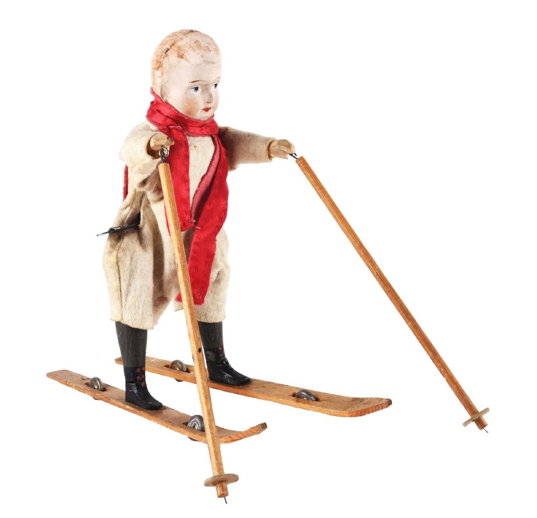 Composition and Painted Wood Wind Up Skier. (1 of 3)