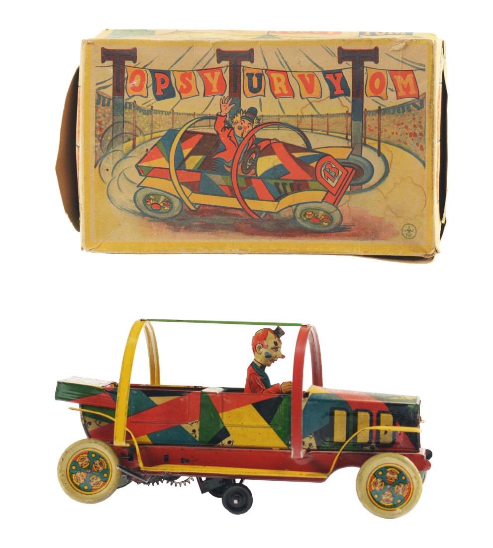 German Tin Litho Wind Up Topsy Turvy Tom Clown Car With: Toy includes a very scarce, colorful original box marked "HE" for Hans Eberl. Made in Germany. Box is complete with all flaps, and has nice circus scenes, one depicting a clown driving the car. Unusua