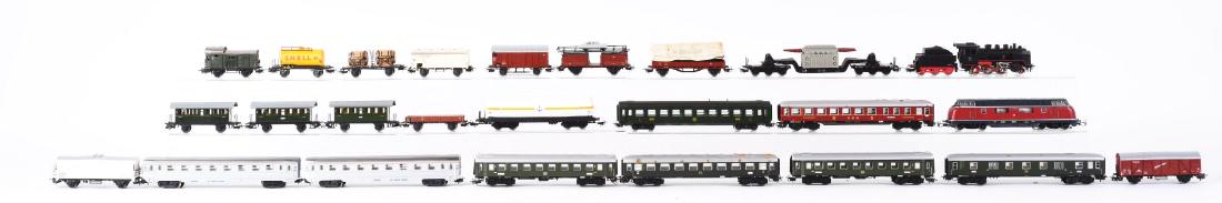Large Lot Of Marklin Locomotives, Passenger & Freight: Lot consists of: No. 3021 Marklin Diesel Locomotive - complete and in like new condition in original box; No. 260 Steam Locomotive and Tender; Marklin Passenger Cars: two No. 4000, No. 4023, No. 4024,