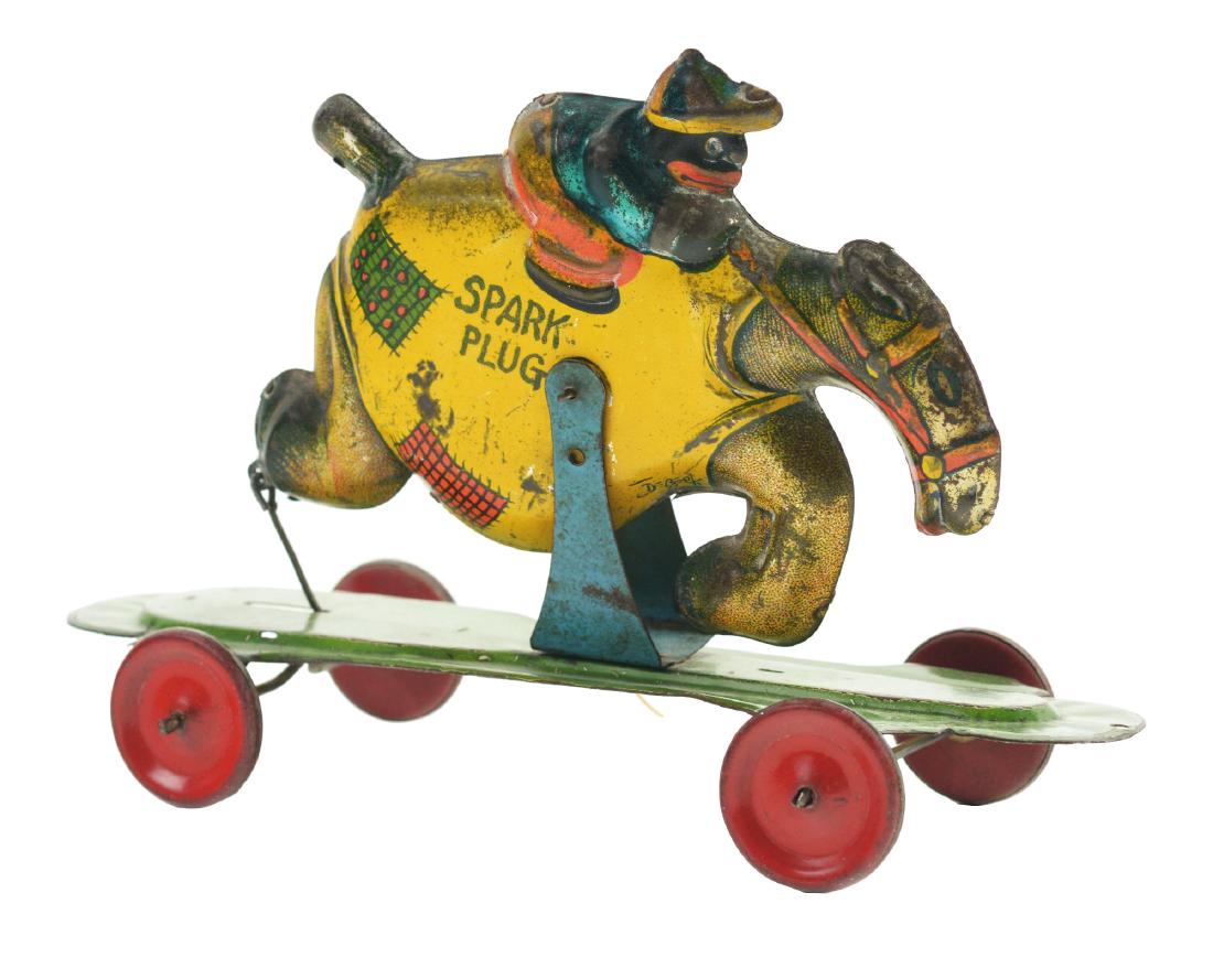 American Tin Litho Snowflake Riding Spark Plug Toy. (1 of 2)