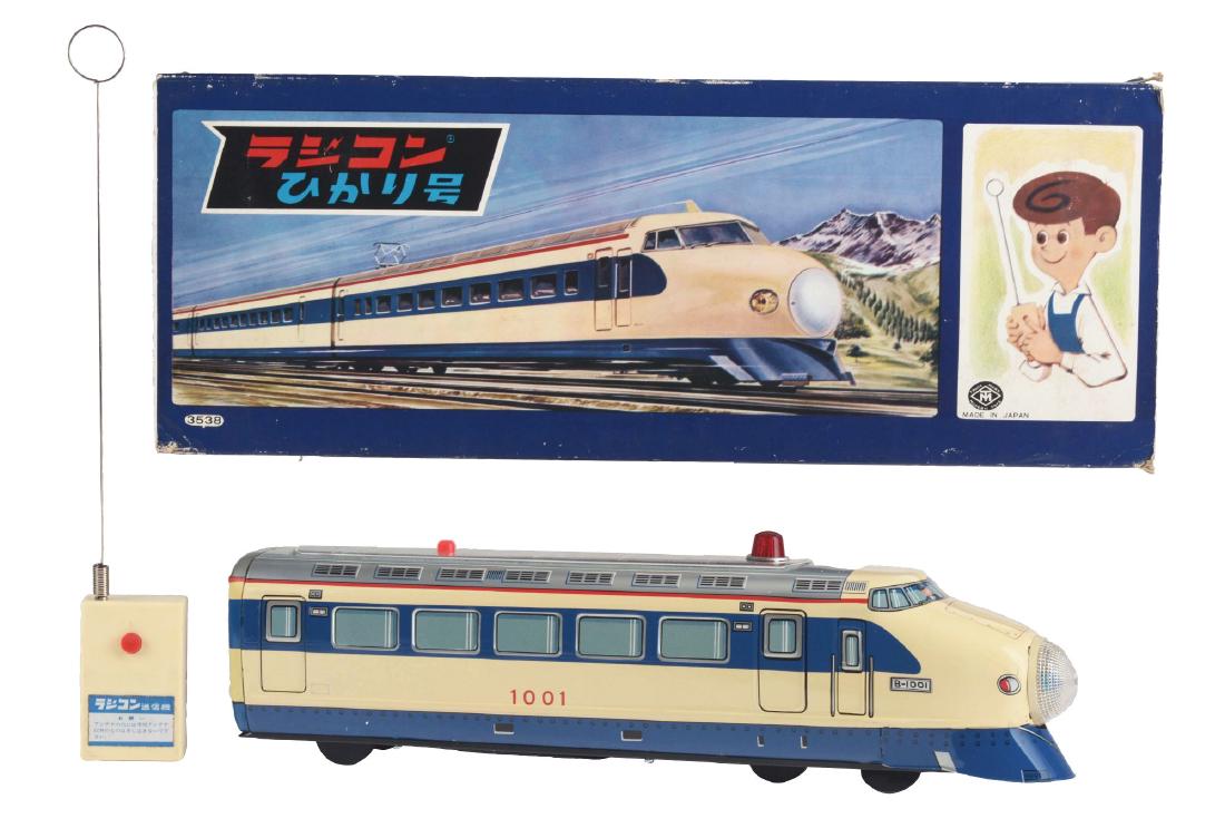 Japanese Battery Operated Hikari Monorail Train In Box.: Includes original box, made by Modern Toys, Japan, with Japanese writing, made for the Japanese market. Radicon type, with original remote and antenna. Nice tin litho to monorail. Monorail is marked "