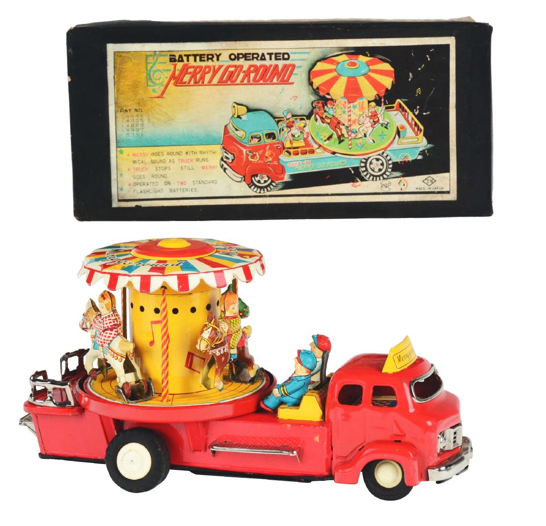 Tin Litho Battery Operated Merry Go Round Truck. (1 of 10)